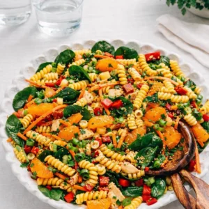 A vibrant bowl of Asian Pasta Salad with mandarin oranges and almonds.