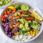 A vibrant Blackened Fish Taco Bowl with avocado and lime crema.