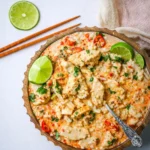 Creamy Coconut Milk Chicken in a bowl with rice and lime