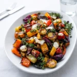 A vibrant bowl of Delightful Roasted Vegetable Salad Recipe with fresh herbs.