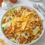 Easy Doritos Taco Salad in a large wooden serving bowl