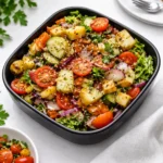 Fresh Garden Salad with tomatoes and cucumbers in a wooden bowl