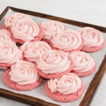 Soft pink lemonade cookies with lemon buttercream frosting