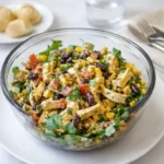 Zesty Southwest Chicken Salad in a wooden bowl with avocado and corn