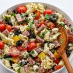 A vibrant bowl of Easy Italian Tortellini Pasta Salad with fresh veggies.