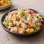 A tropical Hawaiian Chicken Salad served inside a fresh pineapple.